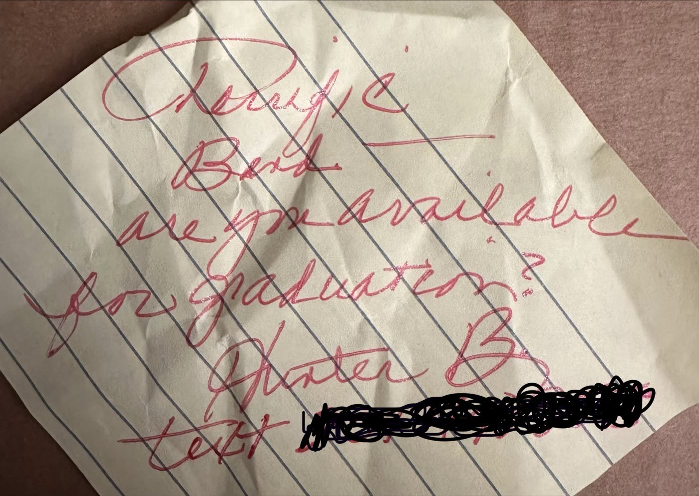Handwritten note from a fan asking if the band is available for a graduation